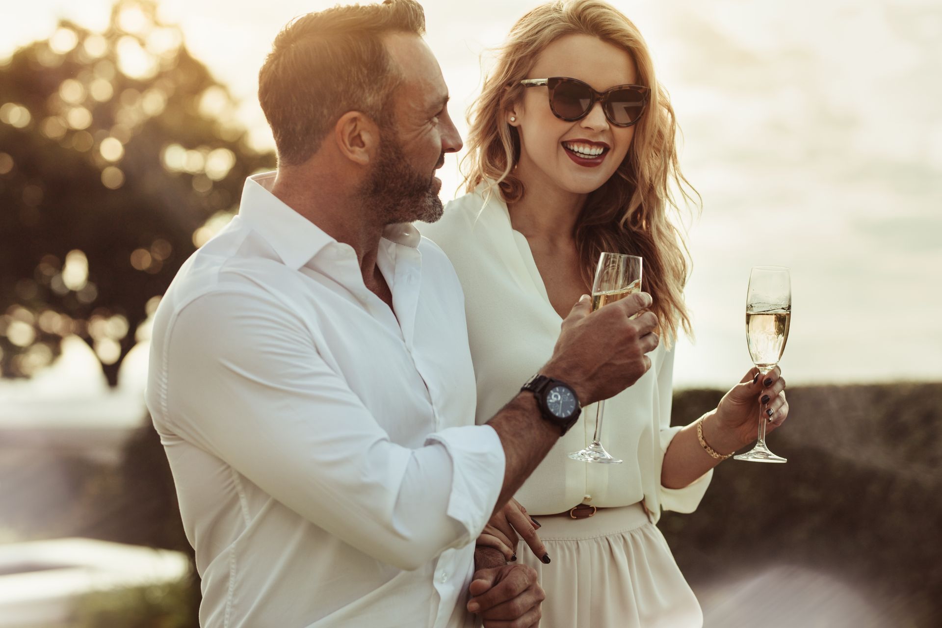 A man and a woman are toasting with champagne glasses.