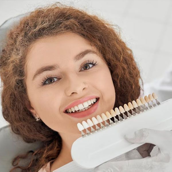 female patient with dental crowns selection | Best Dental Crowns Houston TX 77042