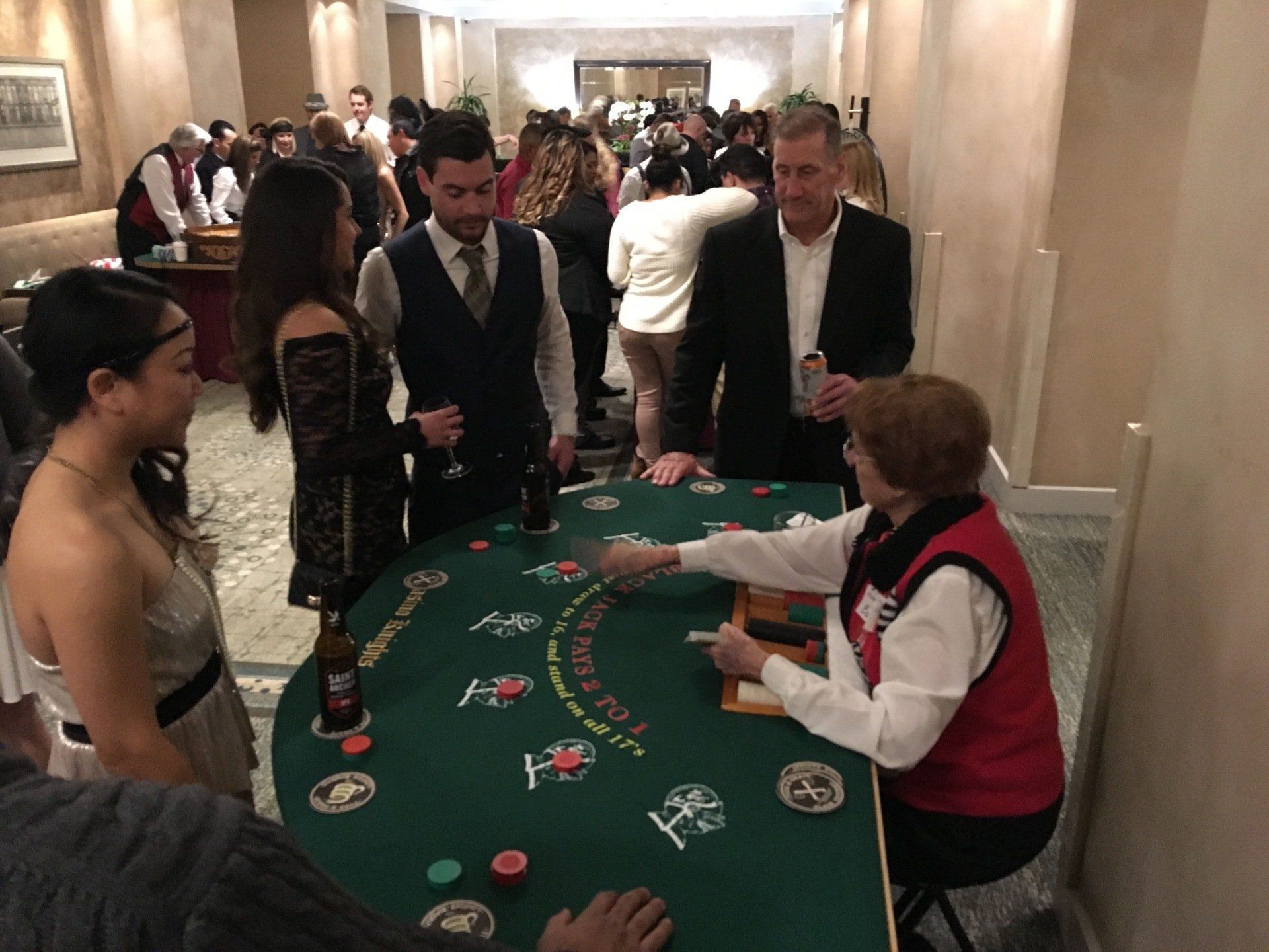 Croupier Holds Poker Cards In A Casino — San Diego, CA — Casino Knight