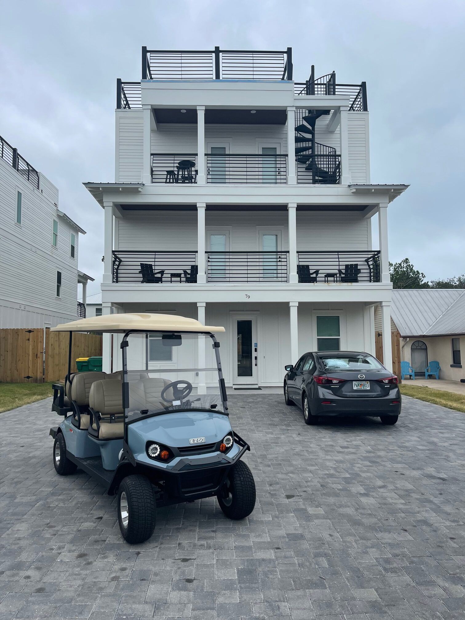 Golf Cart and a Black Car