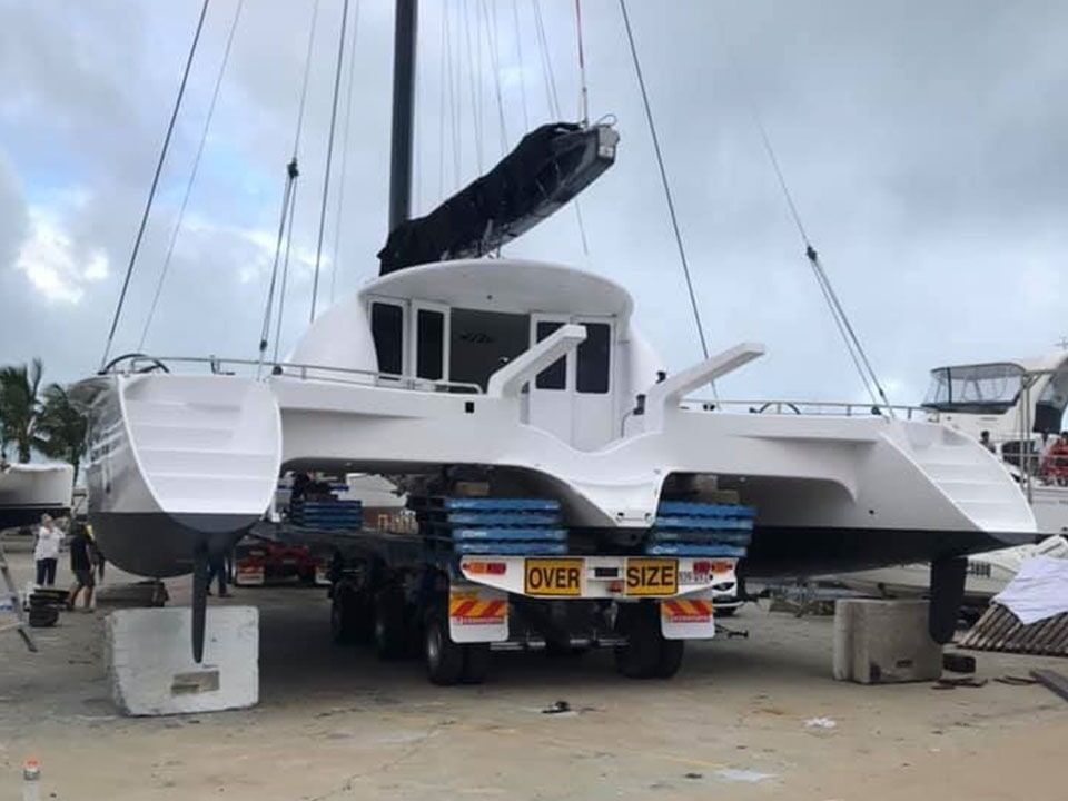 Boat on Truck — Marine Products & Repairs in Mackay, QLD