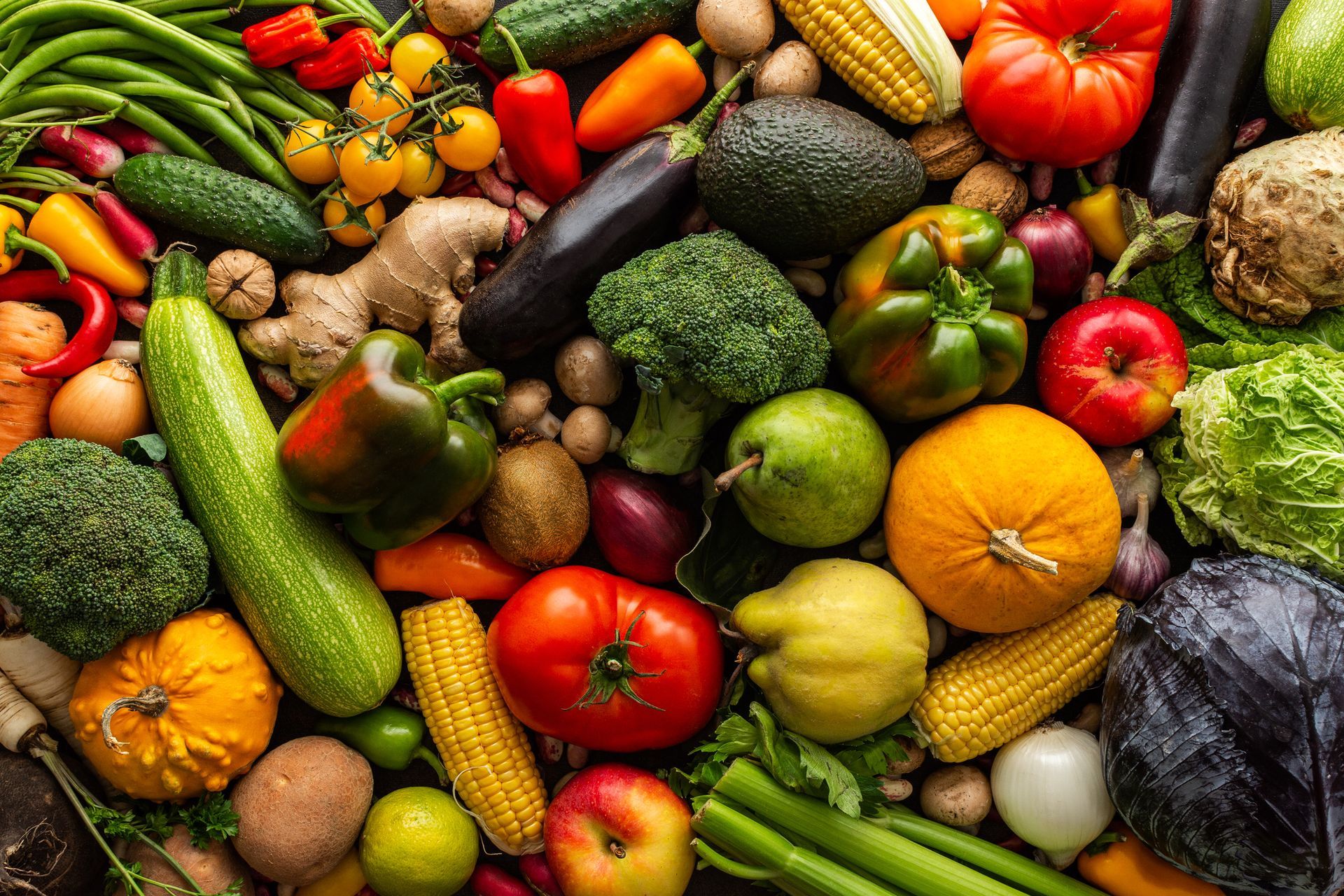 There are many different types of fruits and vegetables in this picture.