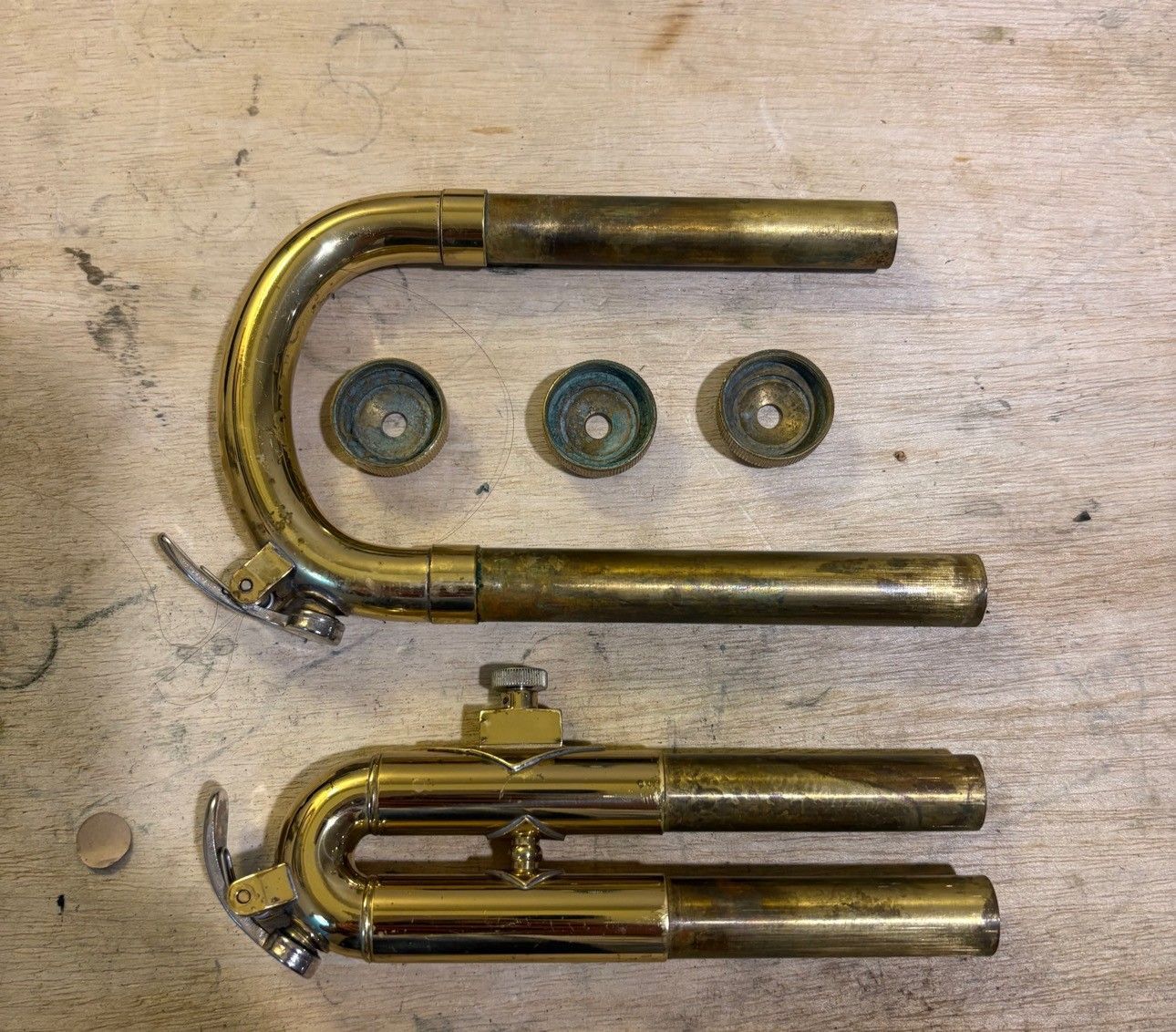 Trumpet slides before cleaning showing corrosion and wear