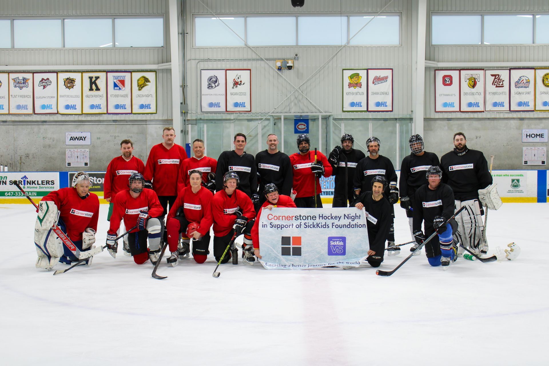 A man and a clown pose for a picture together