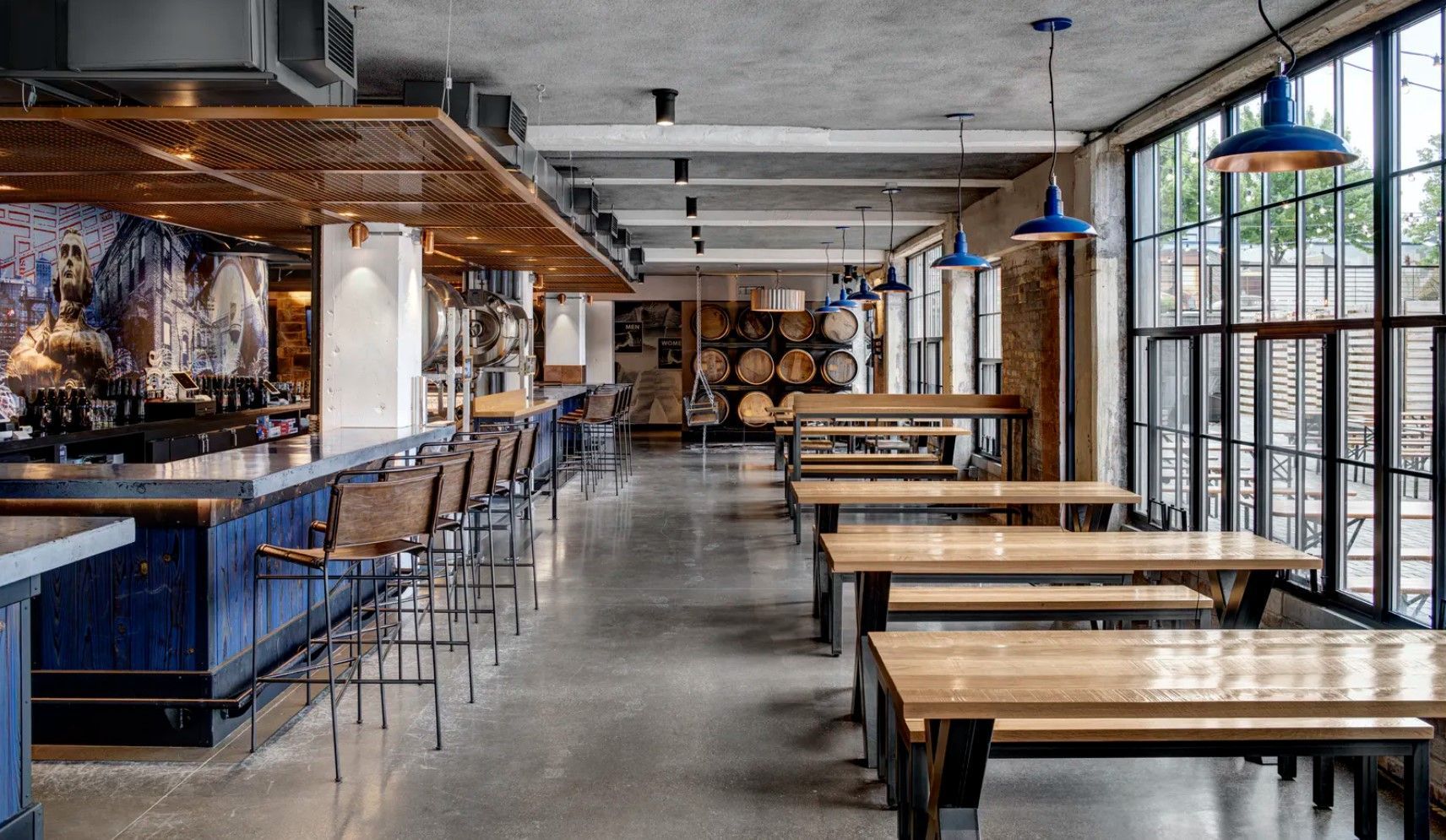 There are a lot of tables and benches in this restaurant.