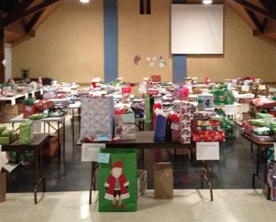 A large room filled with lots of christmas presents