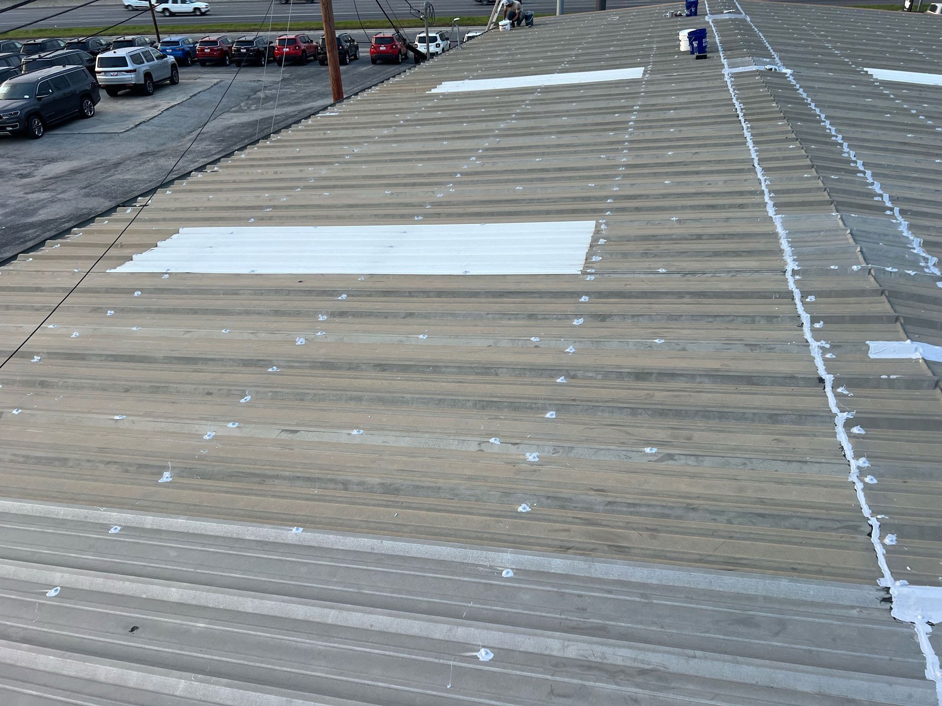 A parking lot with a lot of cars parked on it