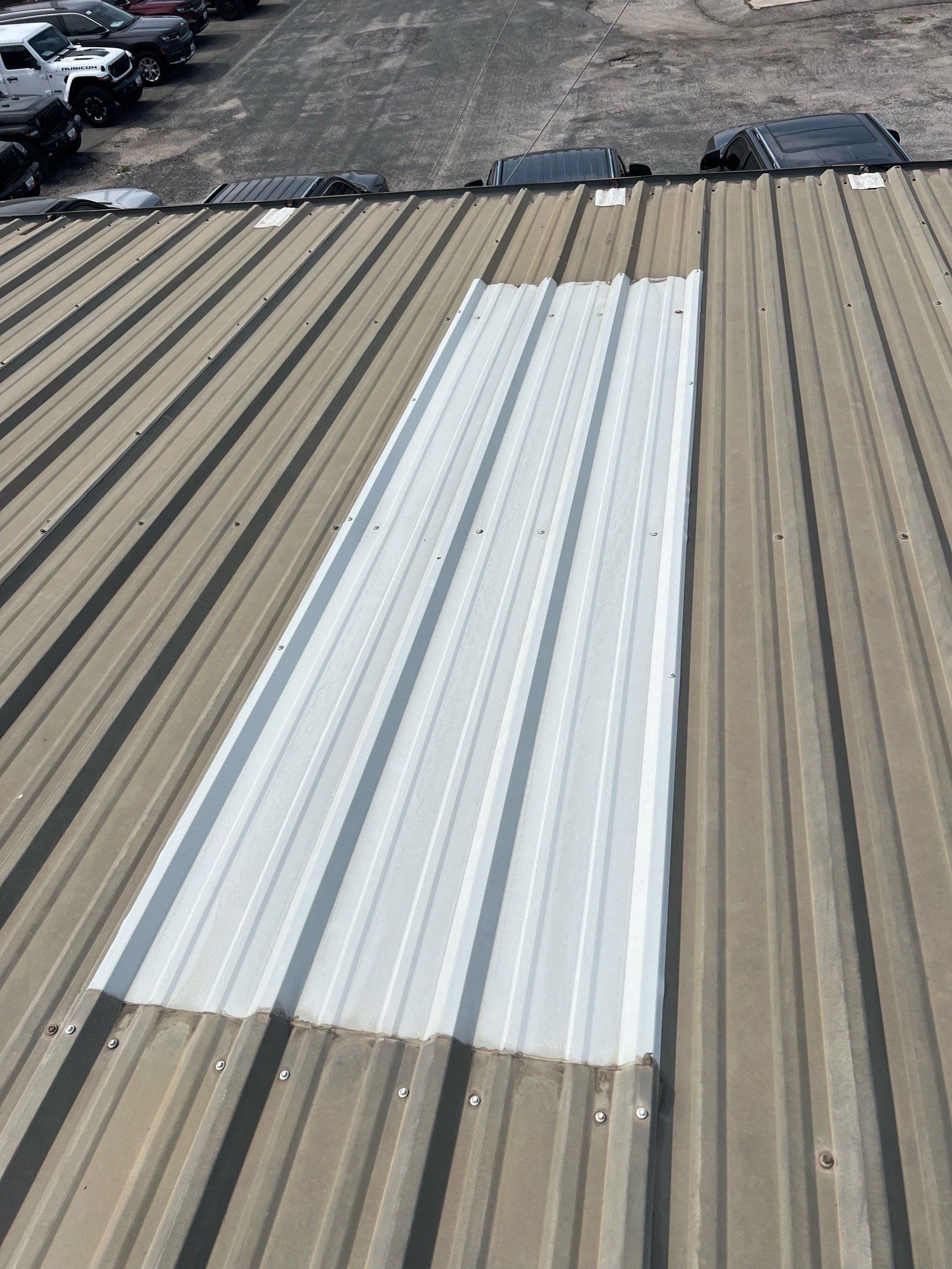 A metal roof with a hole in the middle of it.