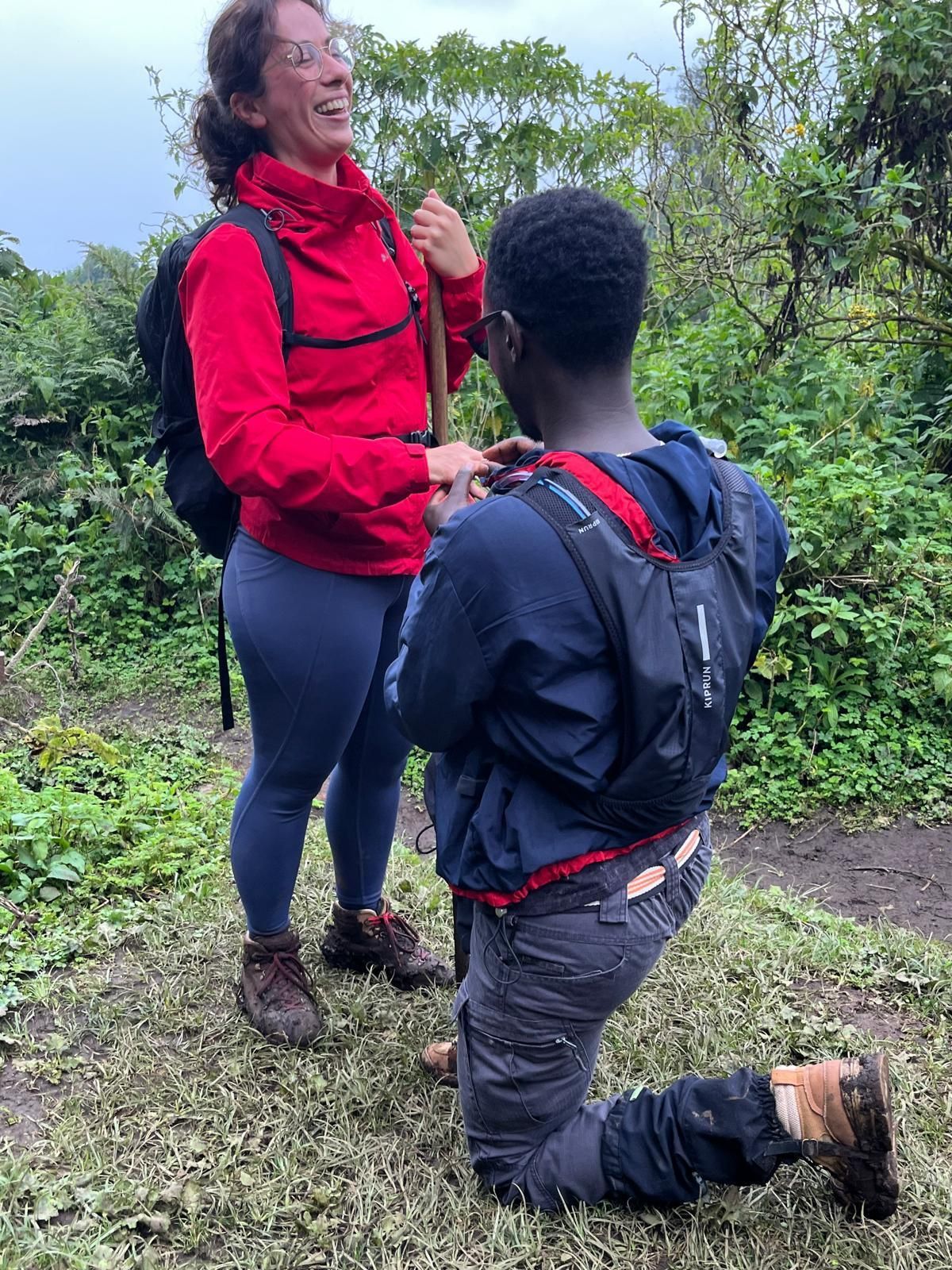 Marriage proposal during Volcanoes National Park hike Rwanda showing magical volcanic landscape