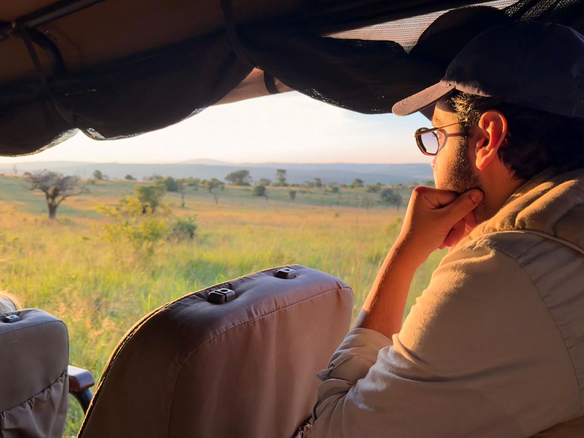 tours admiring the sunset on the open plains of akagera