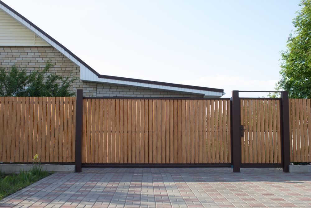 Automatic wooden gate in a private house — Airlie Beach Garage Doors In Proserpine, QLD