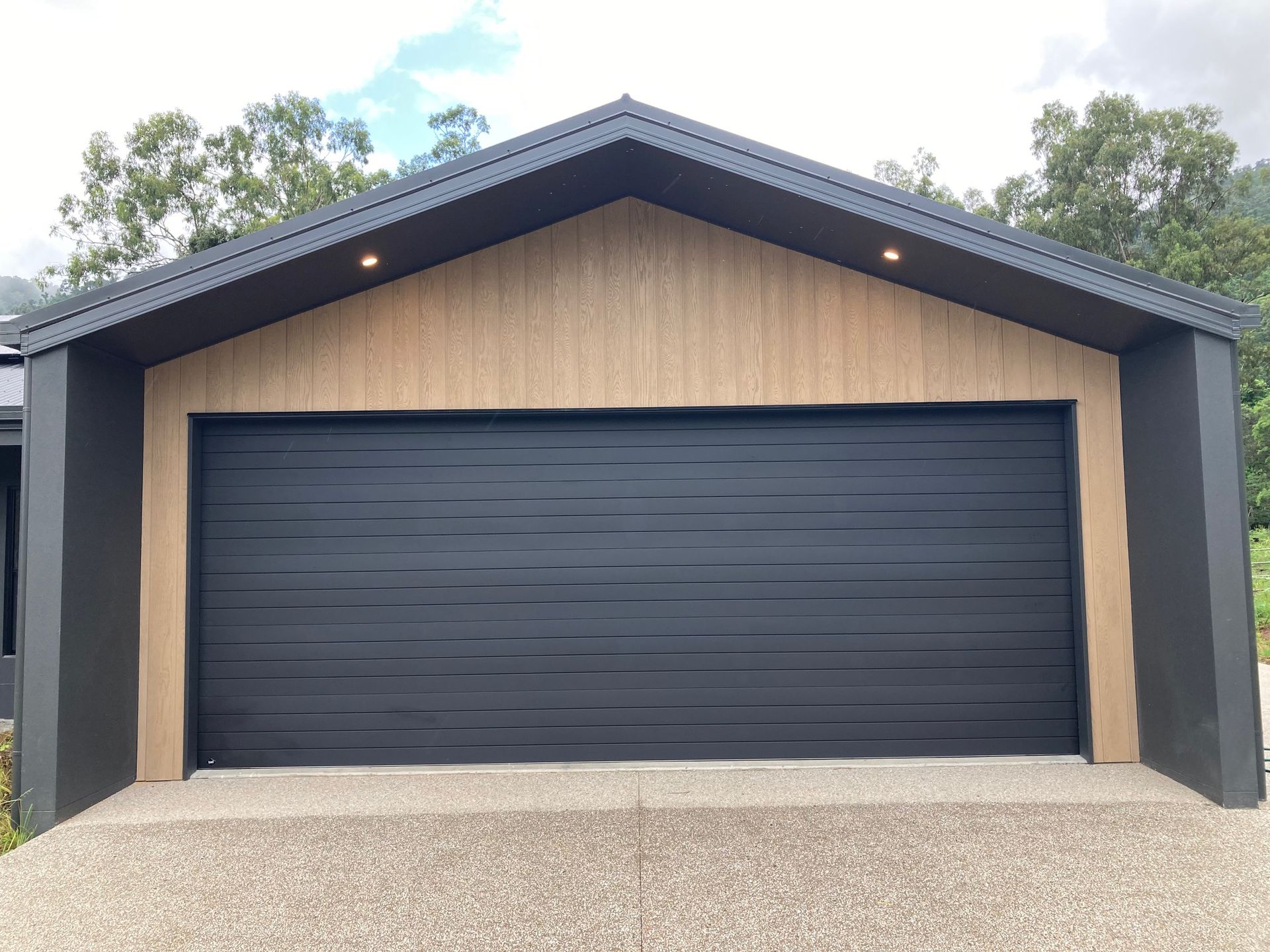 A Row of Garage Doors on the Side of a Building — Airlie Beach Garage Doors In Cannonvale, QLD