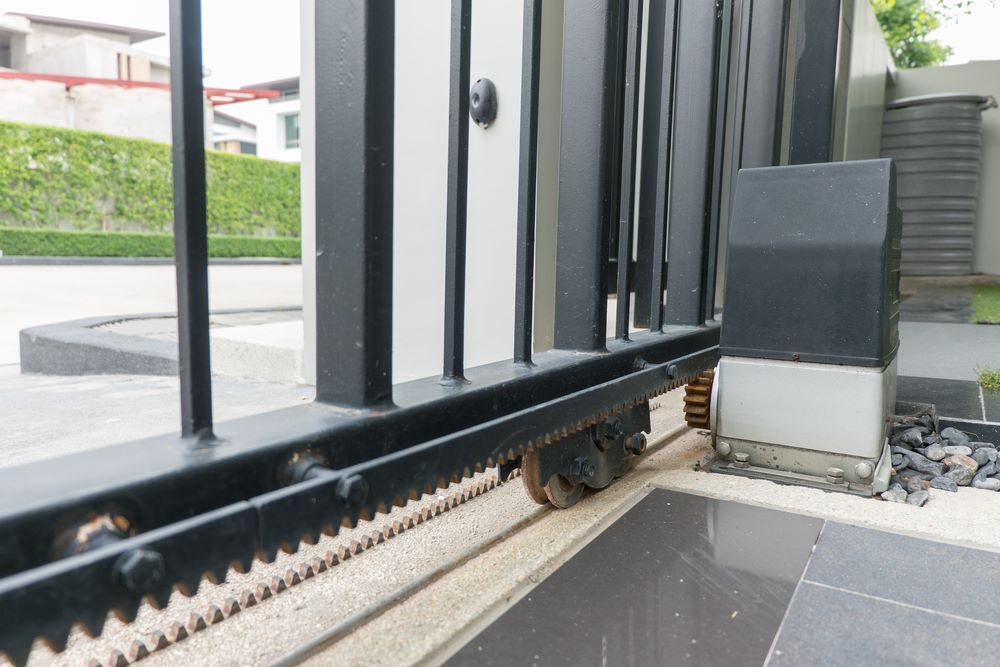 A Close Up of a Sliding Gate With a Motor — Airlie Beach Garage Doors In Cannonvale, QLD