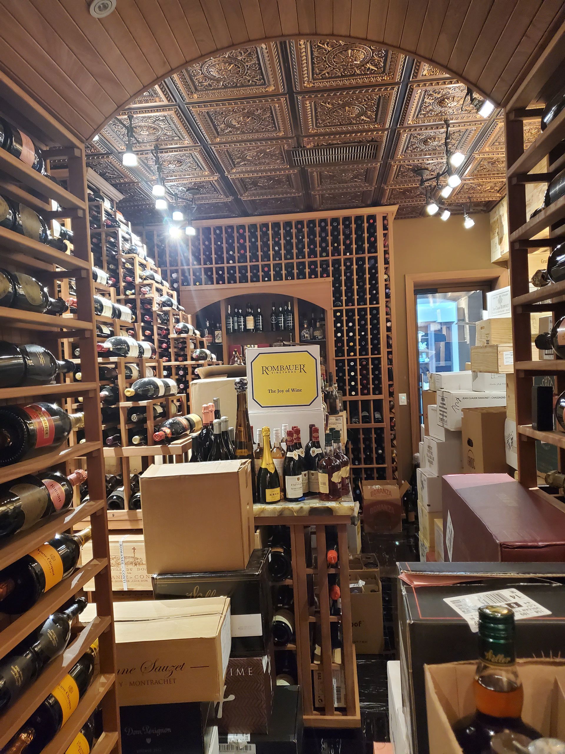 A wine cellar filled with lots of bottles and boxes — Pinellas County, FL —  R. J. Lange  & Son Inc.