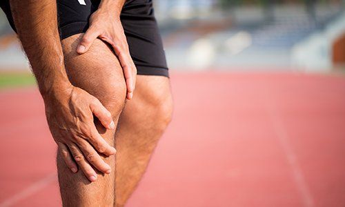 Pain Management — Man Holding His Knee Suffering Muscle Injury in Brea, CA
