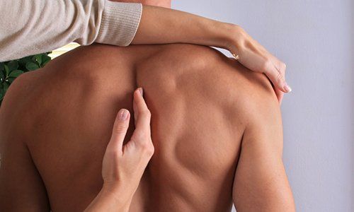 Chiropractor — Man Having Chiropractic Back Adjustment in Brea, CA