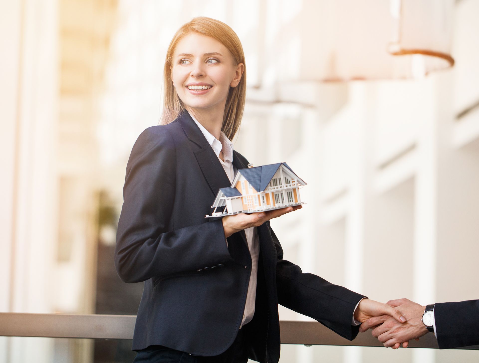 Female real Estate Agent Shaking Hands — Melbourne, FL — Sibley Law & Associates PLLC