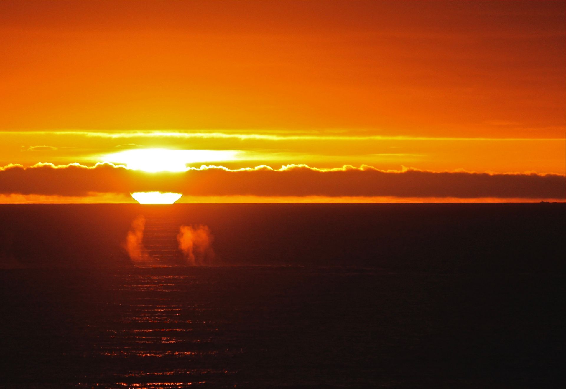 The sun is setting over a body of water