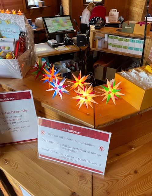 Counter with colorful star decorations and signs.