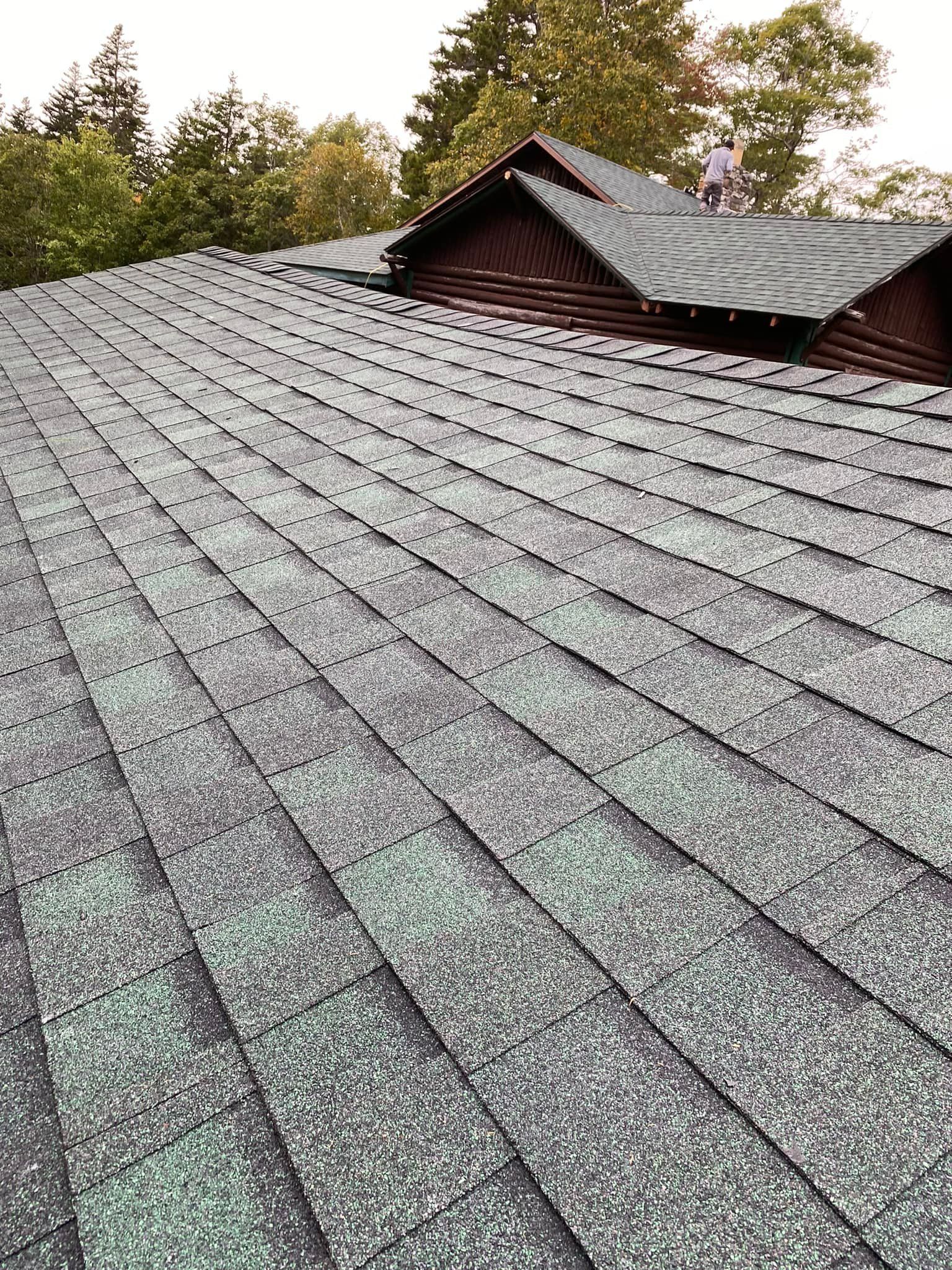 A close up of a roof with shingles on it.
