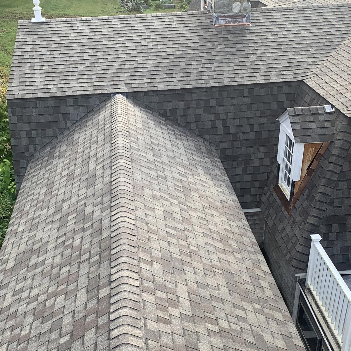 An aerial view of a house with a roof and a window.
