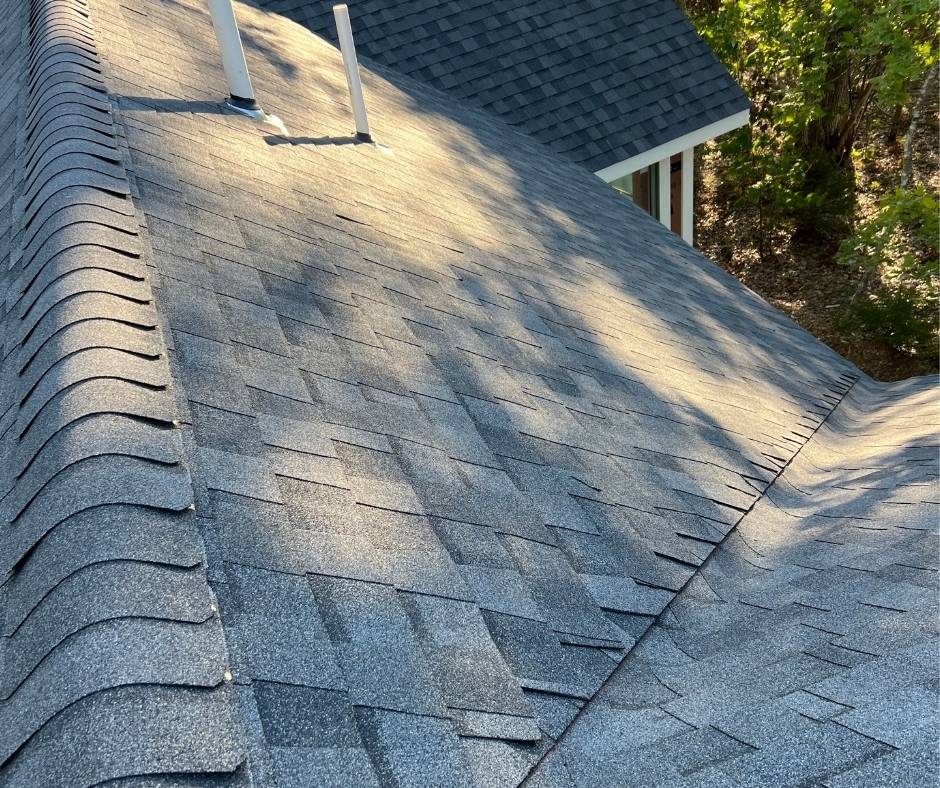 A close up of a roof with shingles on it.