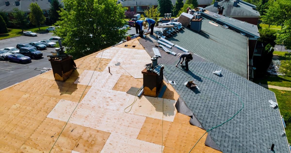 image of roofers working on a roof