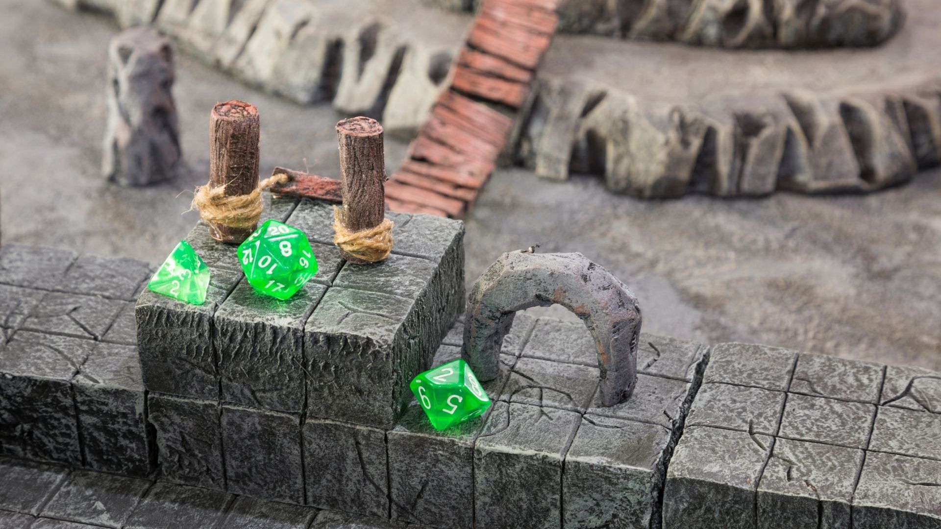 Dice rolling on a stone tabletop with dungeon terrain. Includes wooden posts and small stone archway.
