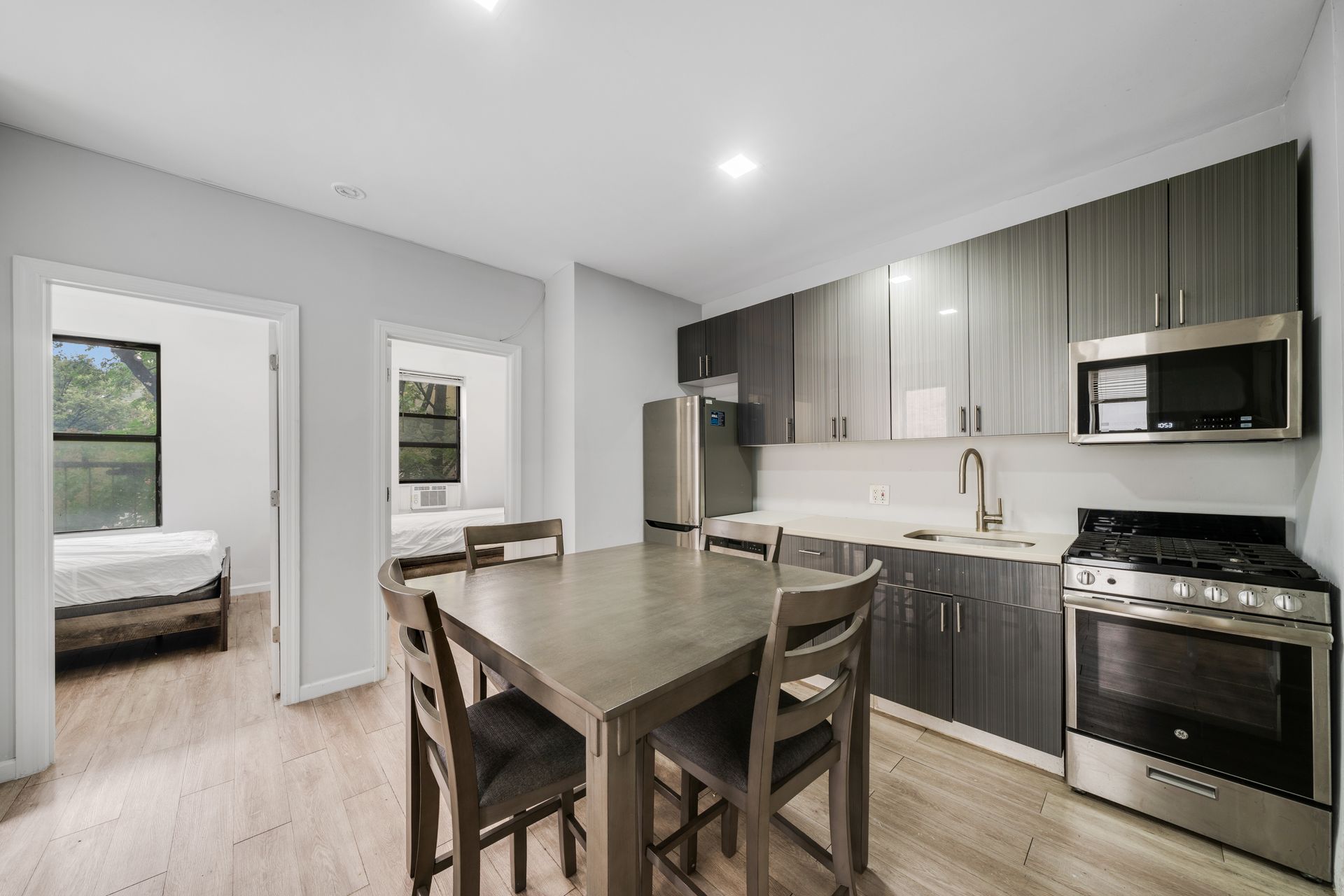 A kitchen with a table and chairs in it