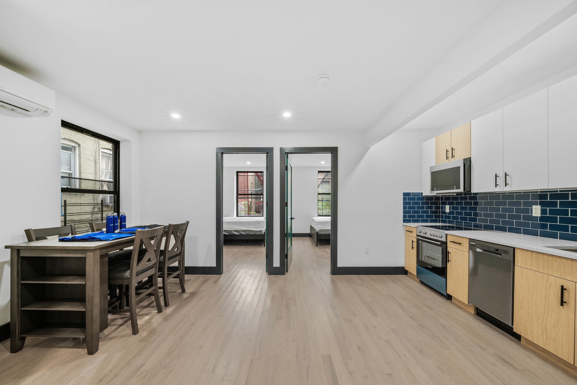 A kitchen with a table and chairs in it