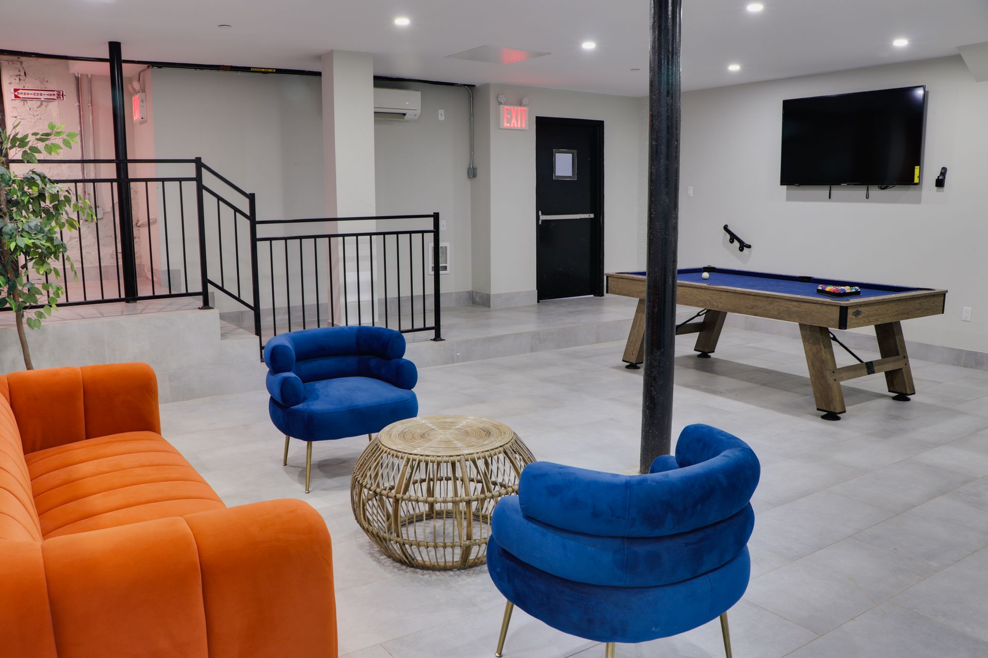 There is a pool table in the middle of the room.