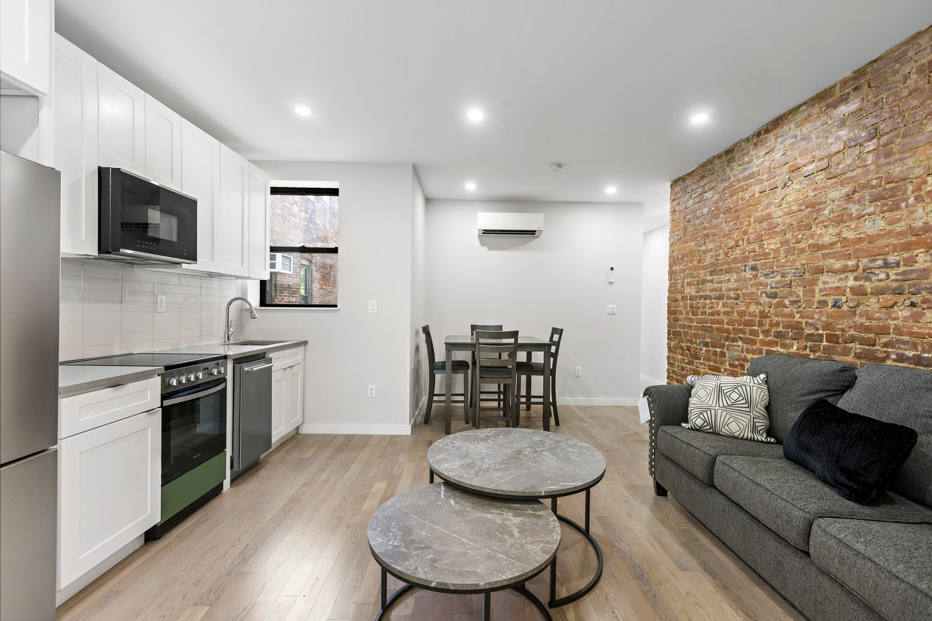 A living room with a couch and two coffee tables