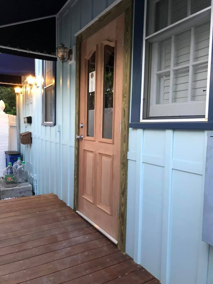 A house with a wooden porch and a wooden door