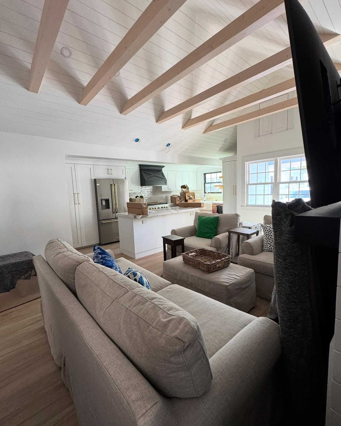 A living room with a couch and a flat screen tv