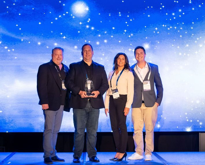 Rok Brothers Staff receiving an award