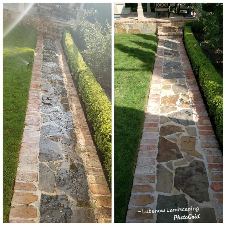 Stone garden walkway bordered by brick and hedges, shown before and after cleaning in sunlight.