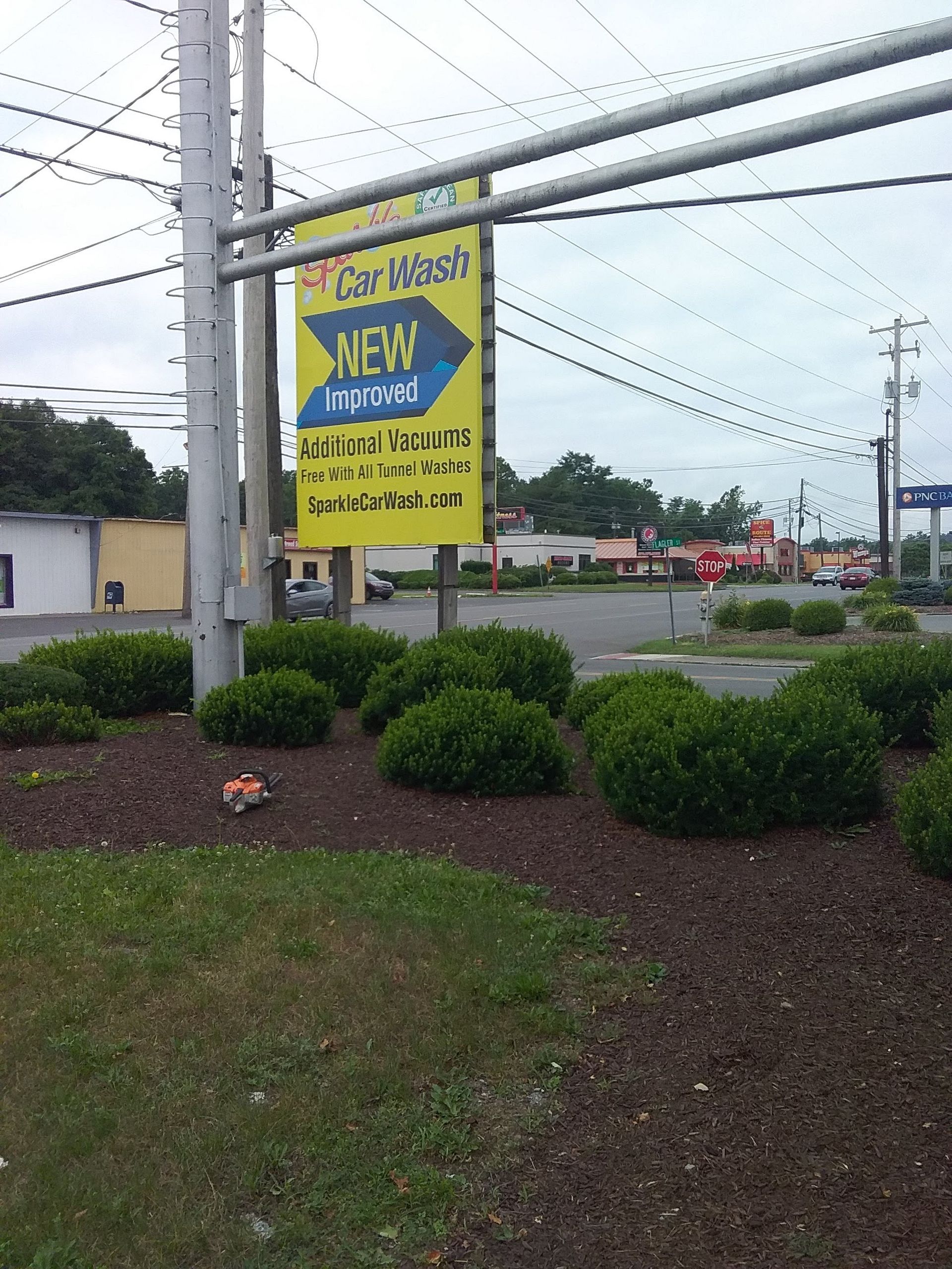 A yellow sign that says new on it