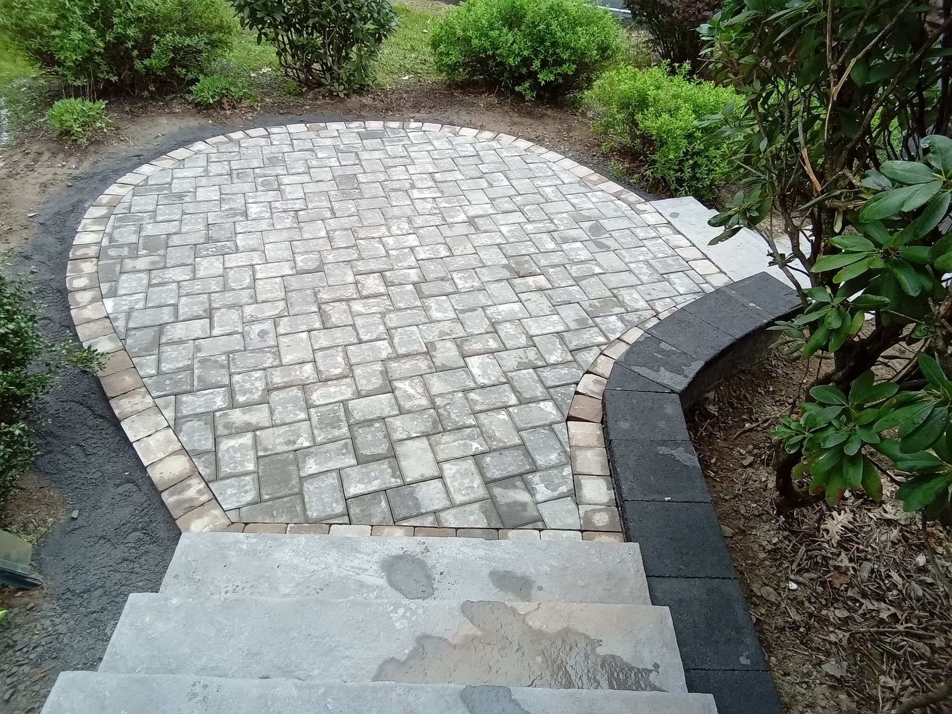 A stone walkway with stairs leading up to it