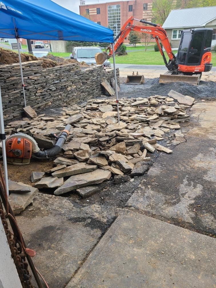 Stairs leading up to a house, hardscaping by A.A.F Landscaping