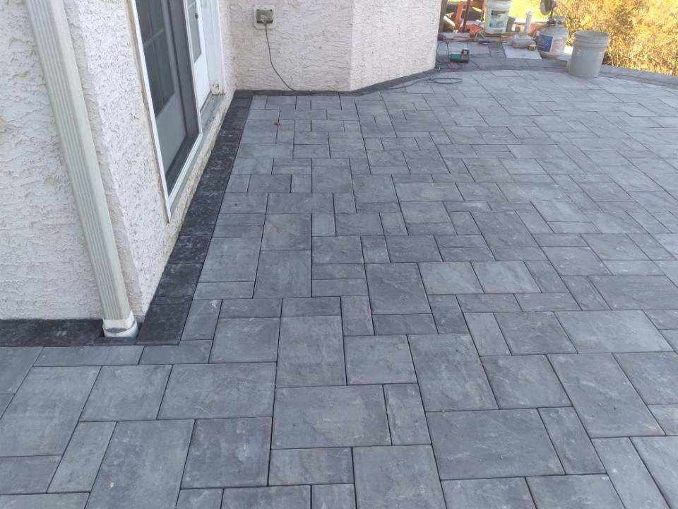 Close up of grey stone patio by A.A.F Landscaping