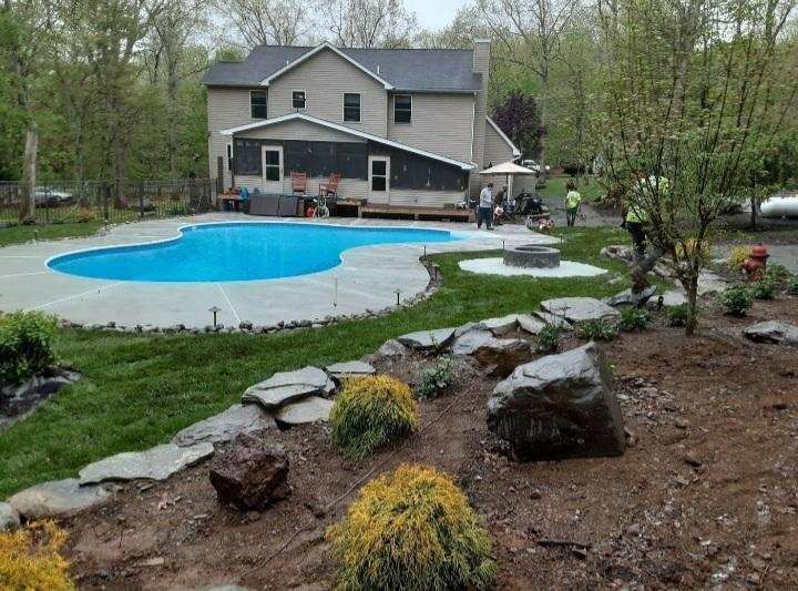 Home with a pool and landscaping by A.A.F Landscaping