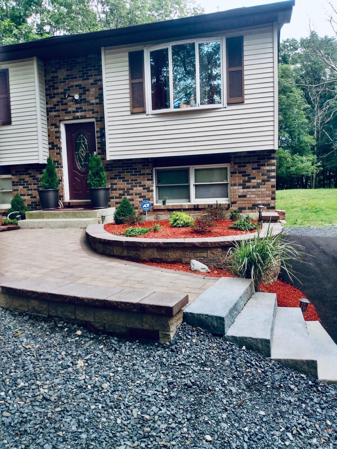 a house with stairs leading up to the front door
