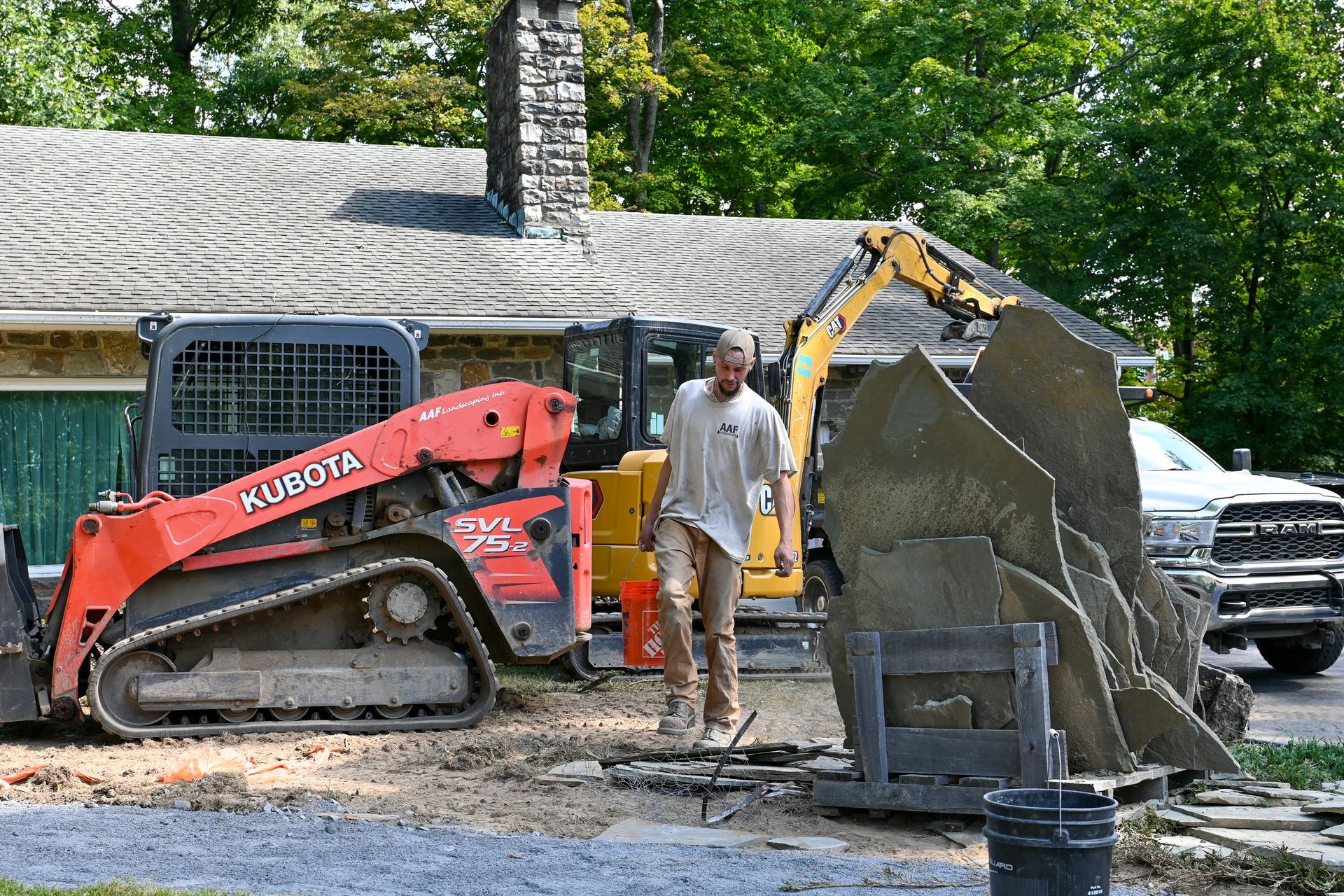 A bulldozer is loading dirt into a hole in the ground.
