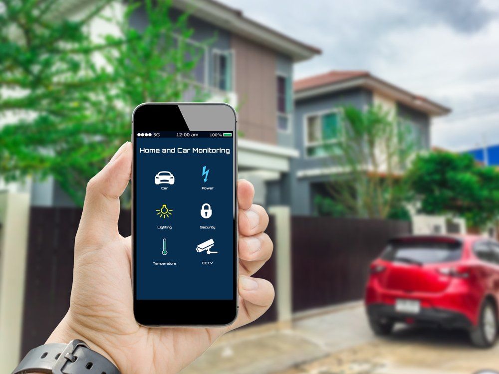Man Using an App for His Home and Car