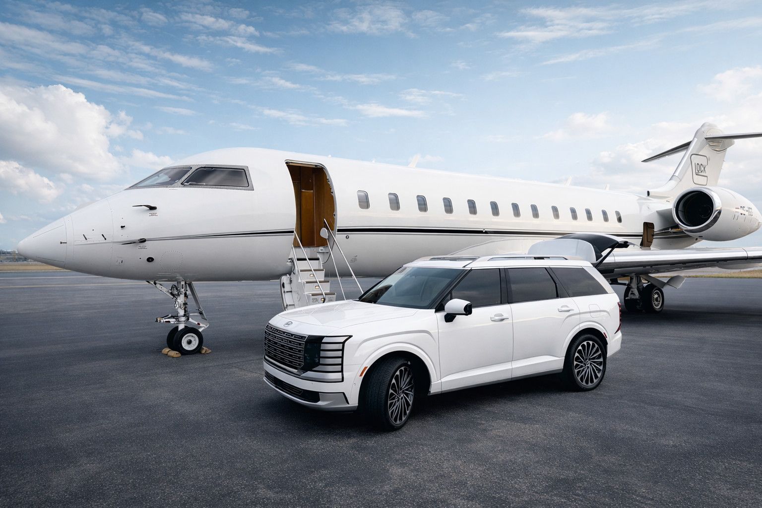 White jet and SUV parked on tarmac, door of jet open, blue sky background.