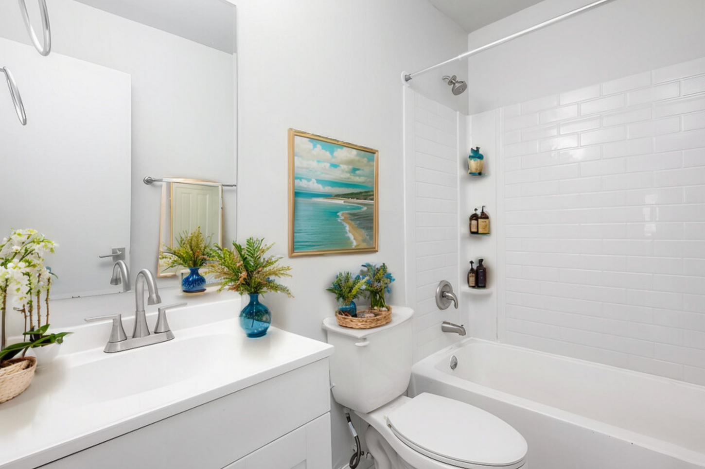 A bathroom with a toilet , sink , and bathtub.