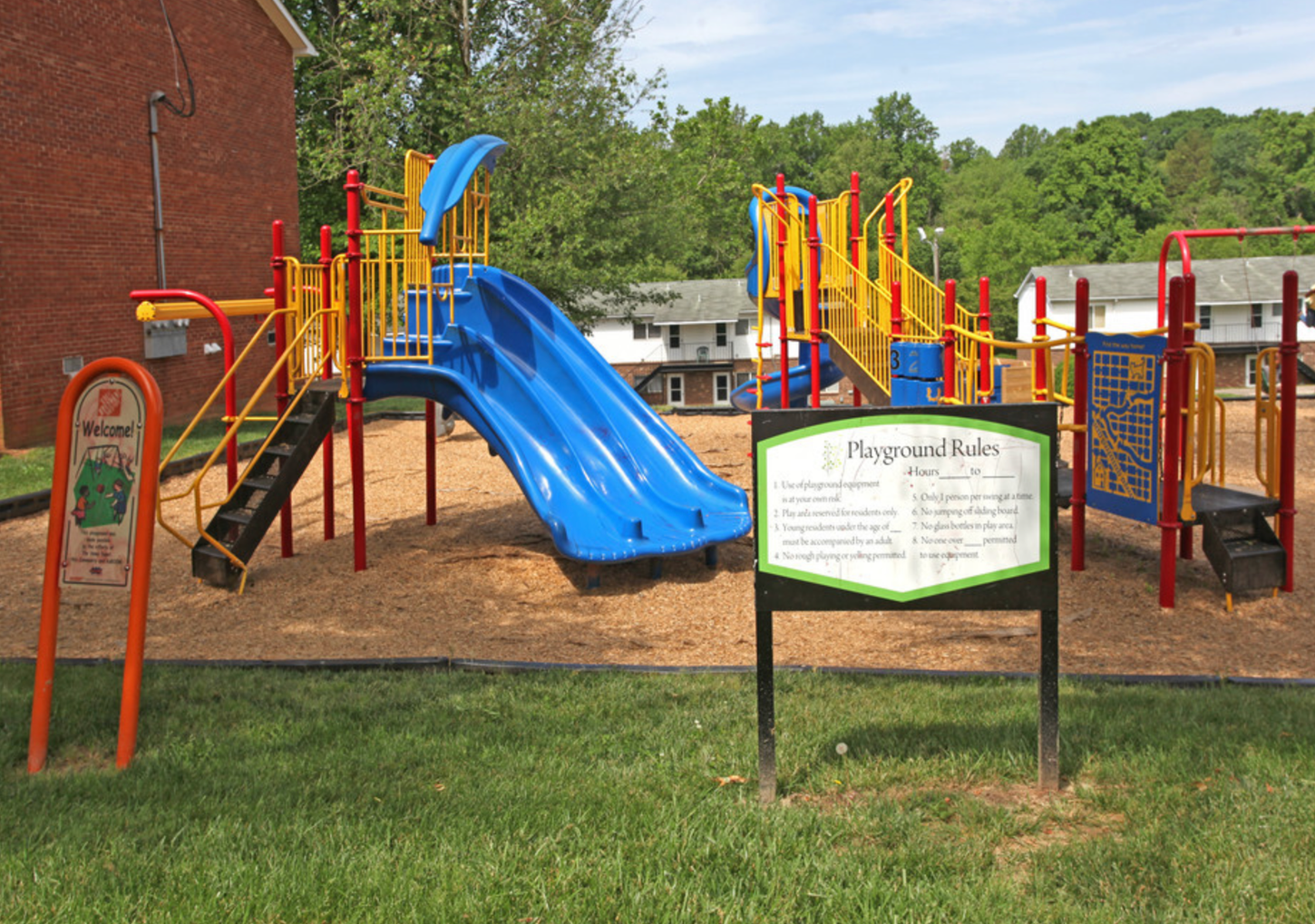 A playground with a sign that says playground rules