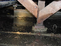 A flooded basement with a lot of water coming out of it.