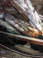 A close up of a wooden structure with a lot of dust on it.