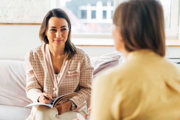 Two women talking to each other.